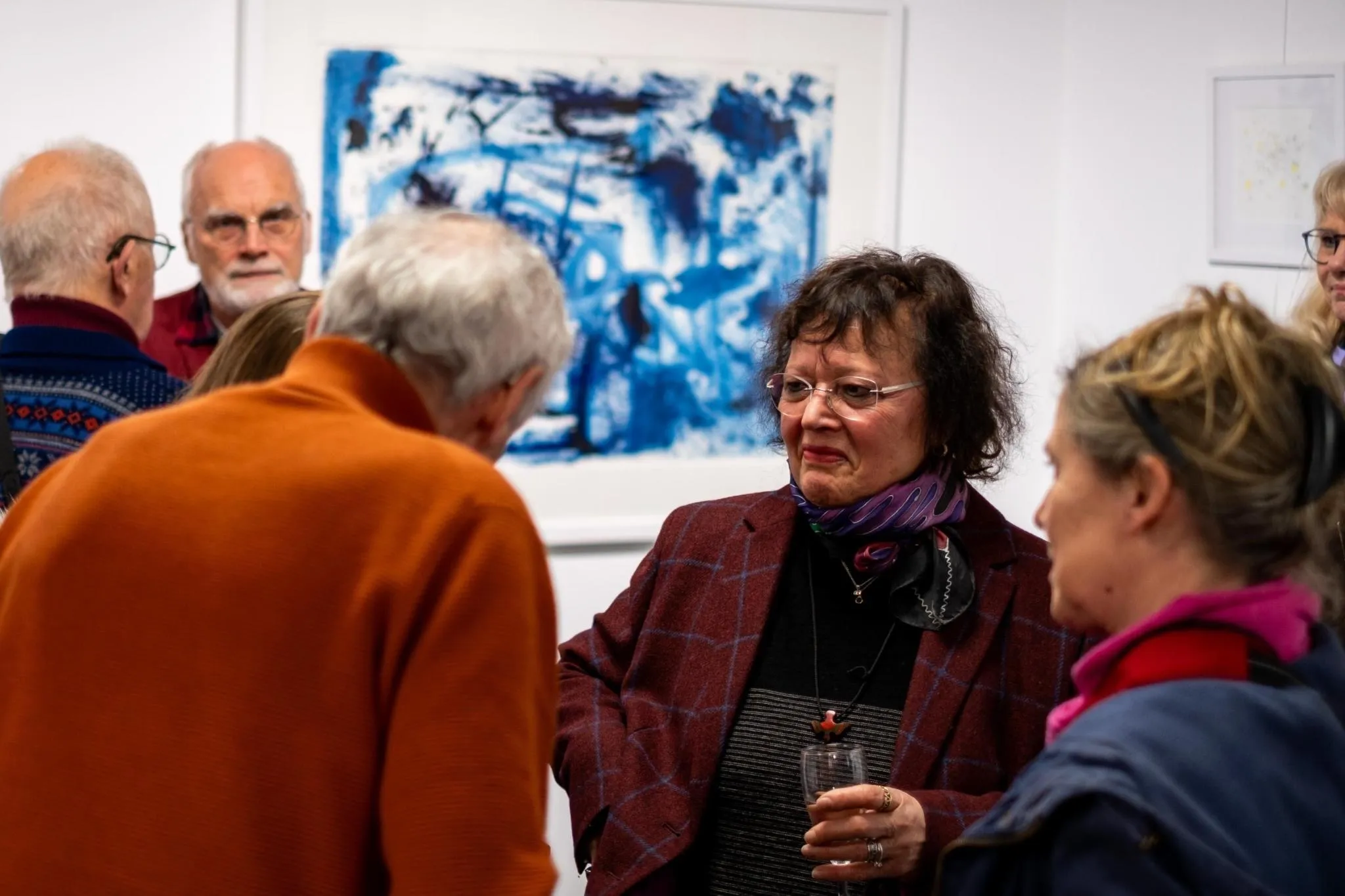 Guests conversing at the vernissage